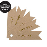 10 CELEBRATE GOLD FLAG TAGS ON KRAFT